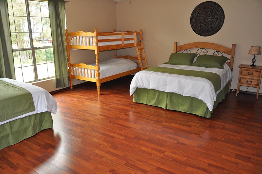 Image of the beds in one of the bedrooms at the Lake House.